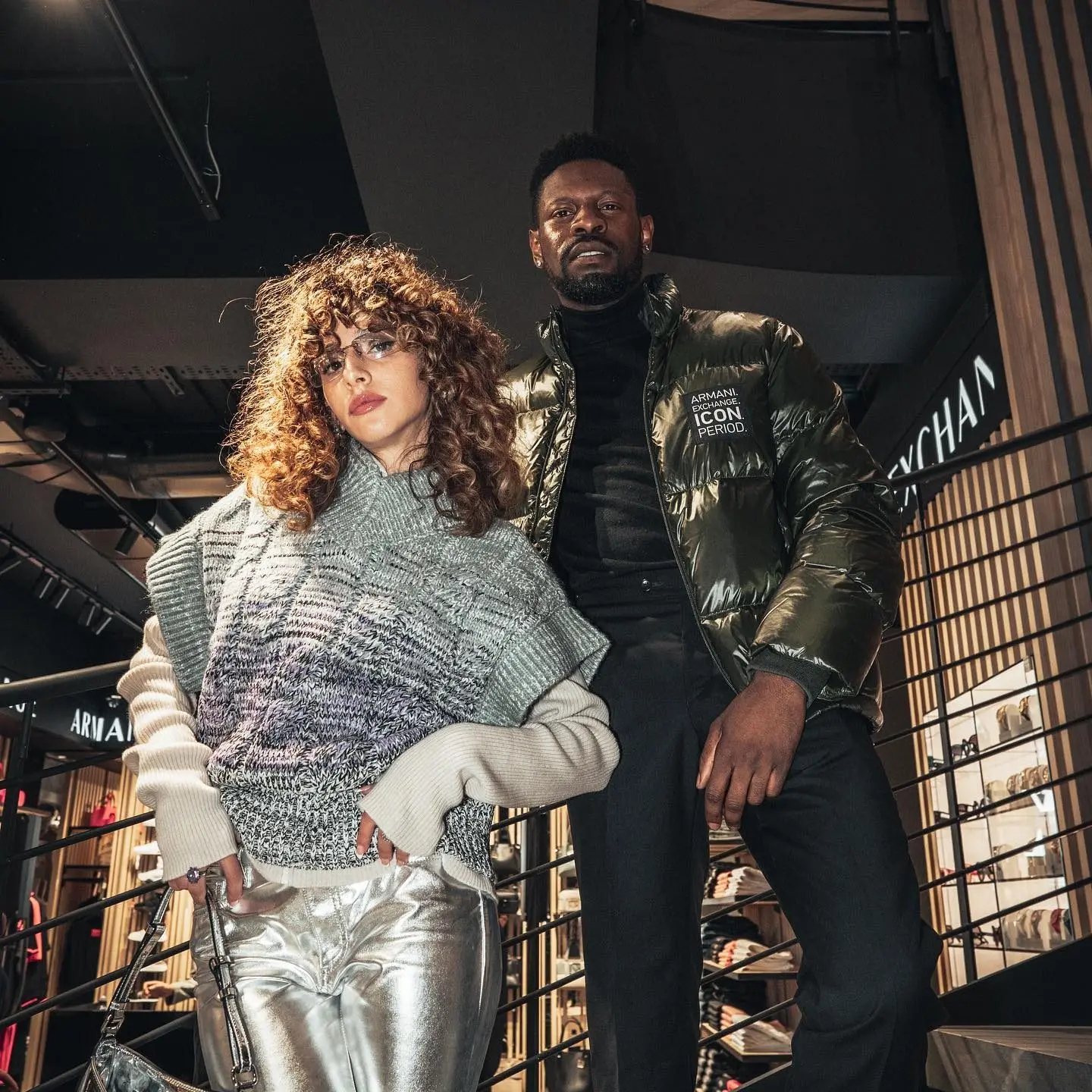 Two models posing on stairs