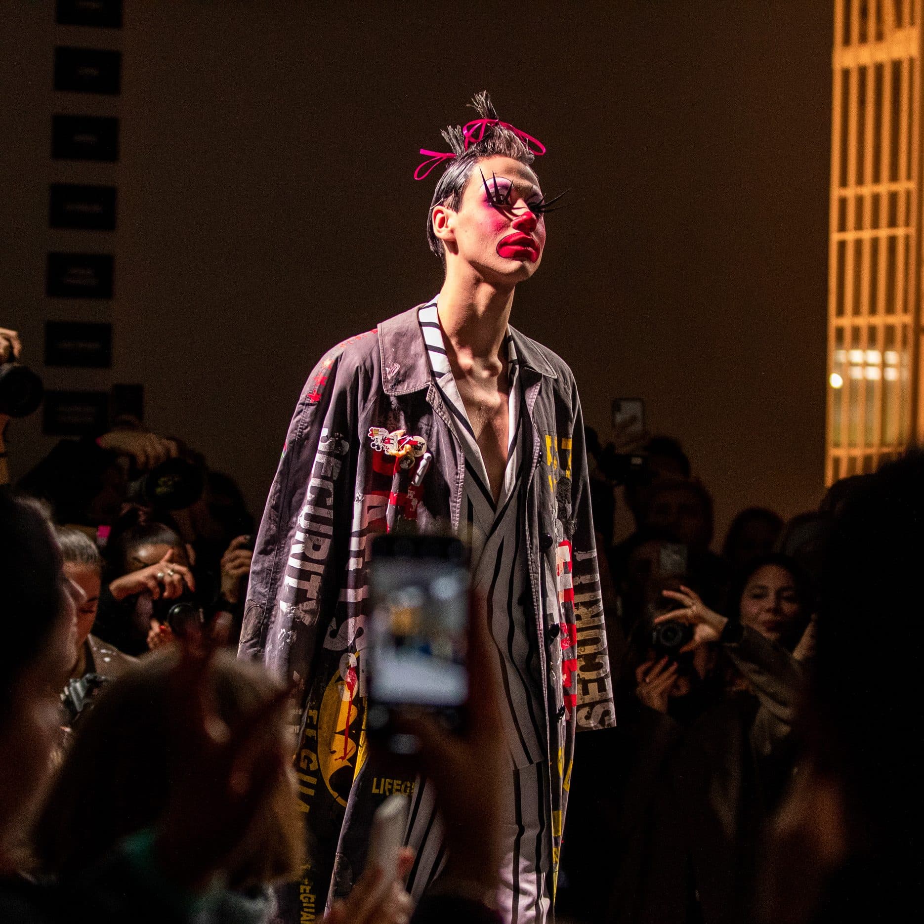 Male model walking down runway