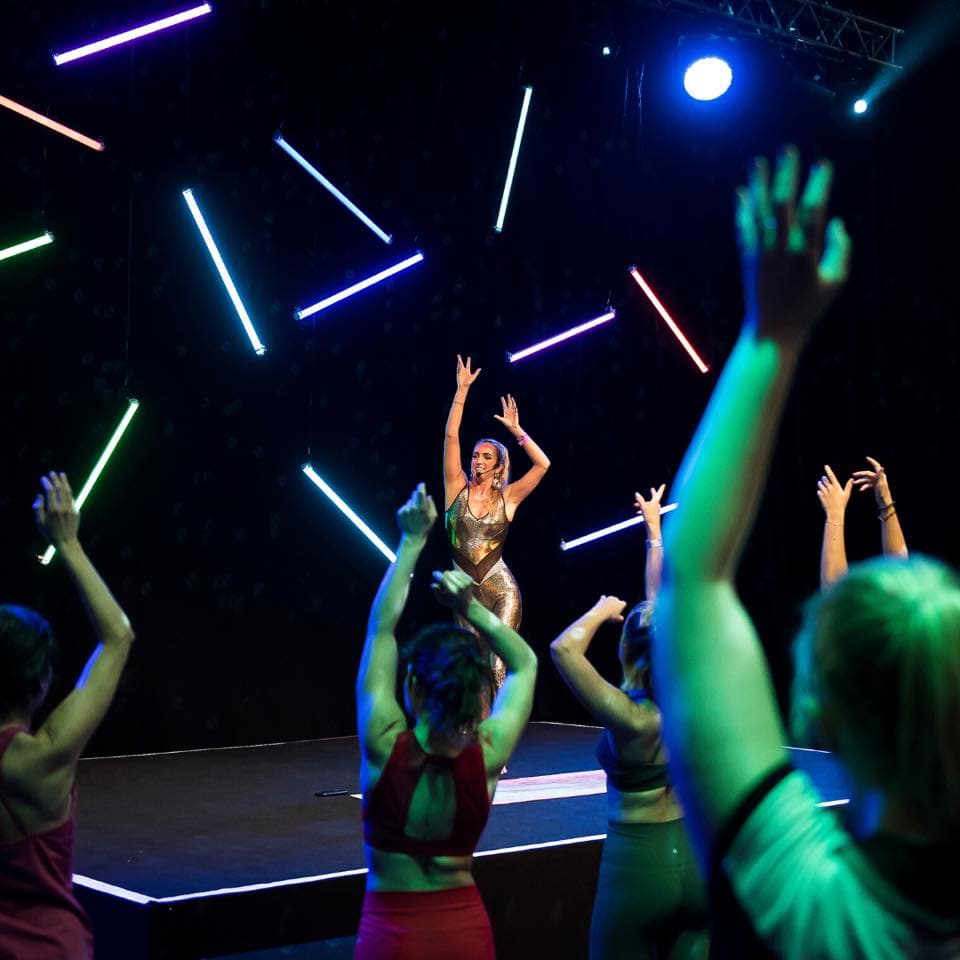 Female instructor leading exercise class