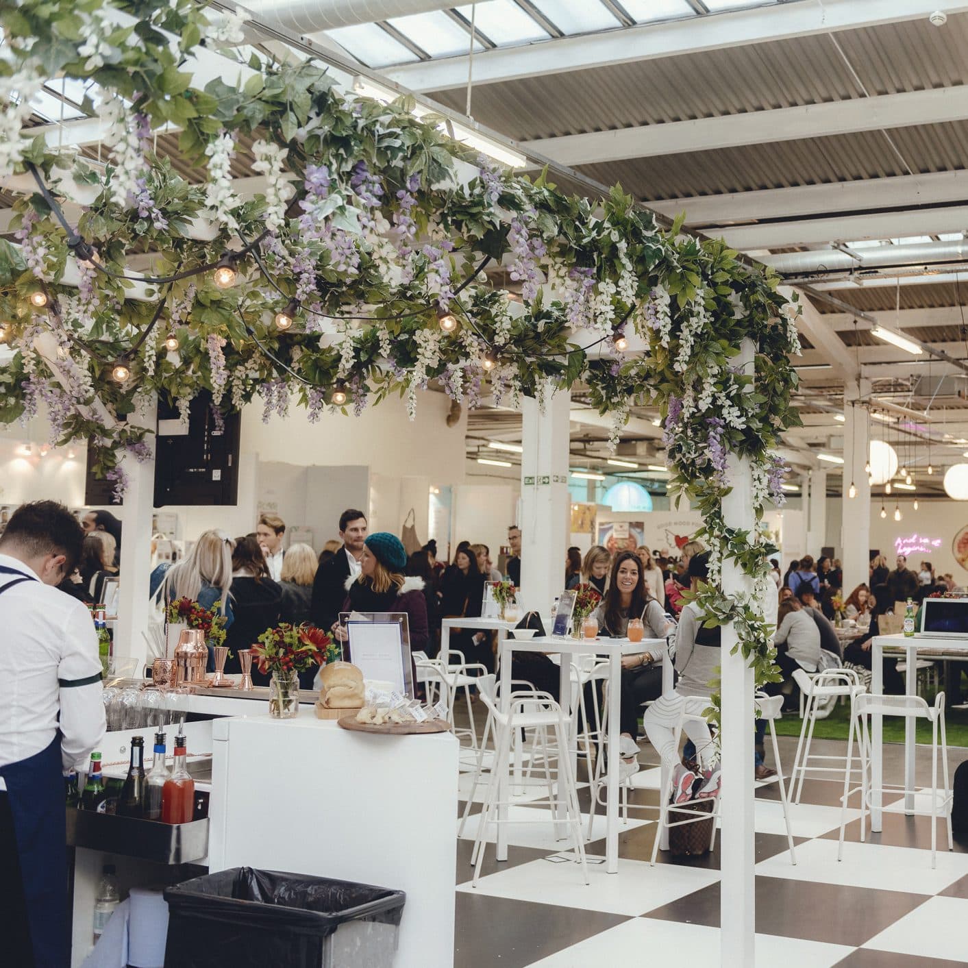 Festival attendees sat at white tables